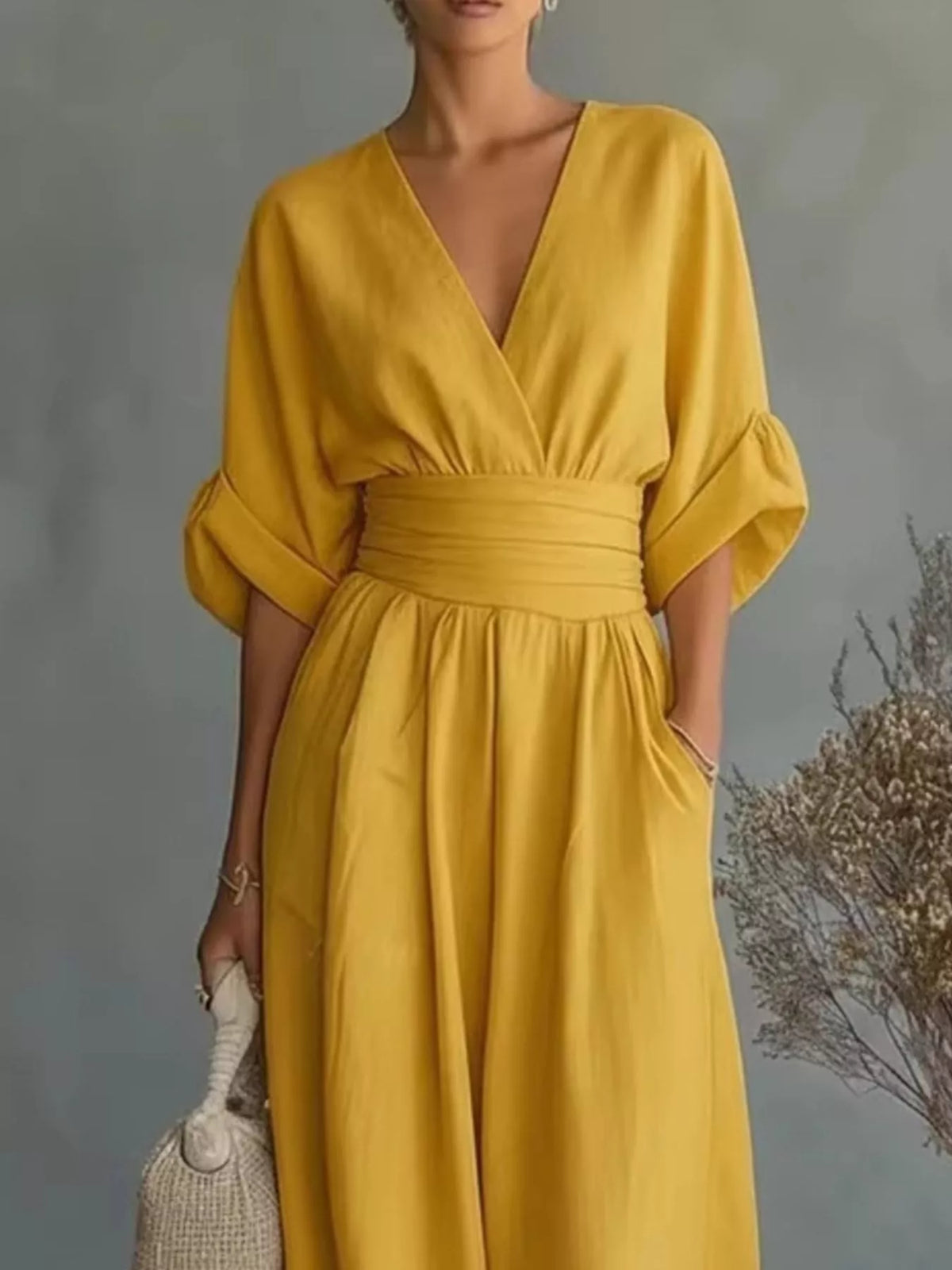 Yellow plus size jumpsuit with V-neck, half sleeves, gathered waist, wide-leg pants