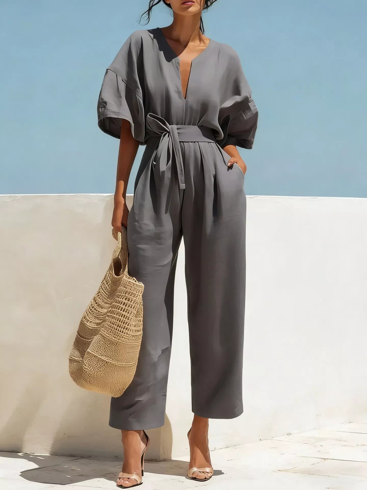 Gray tie-waist wide-leg jumpsuit with V-neck and short puff sleeves