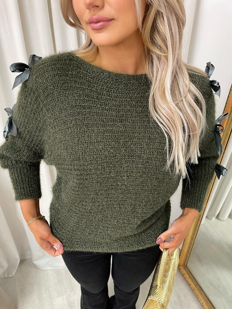 "Chunky knitted top with cut-out tie bow sleeve detail in beige, perfect for cozy winter wear."