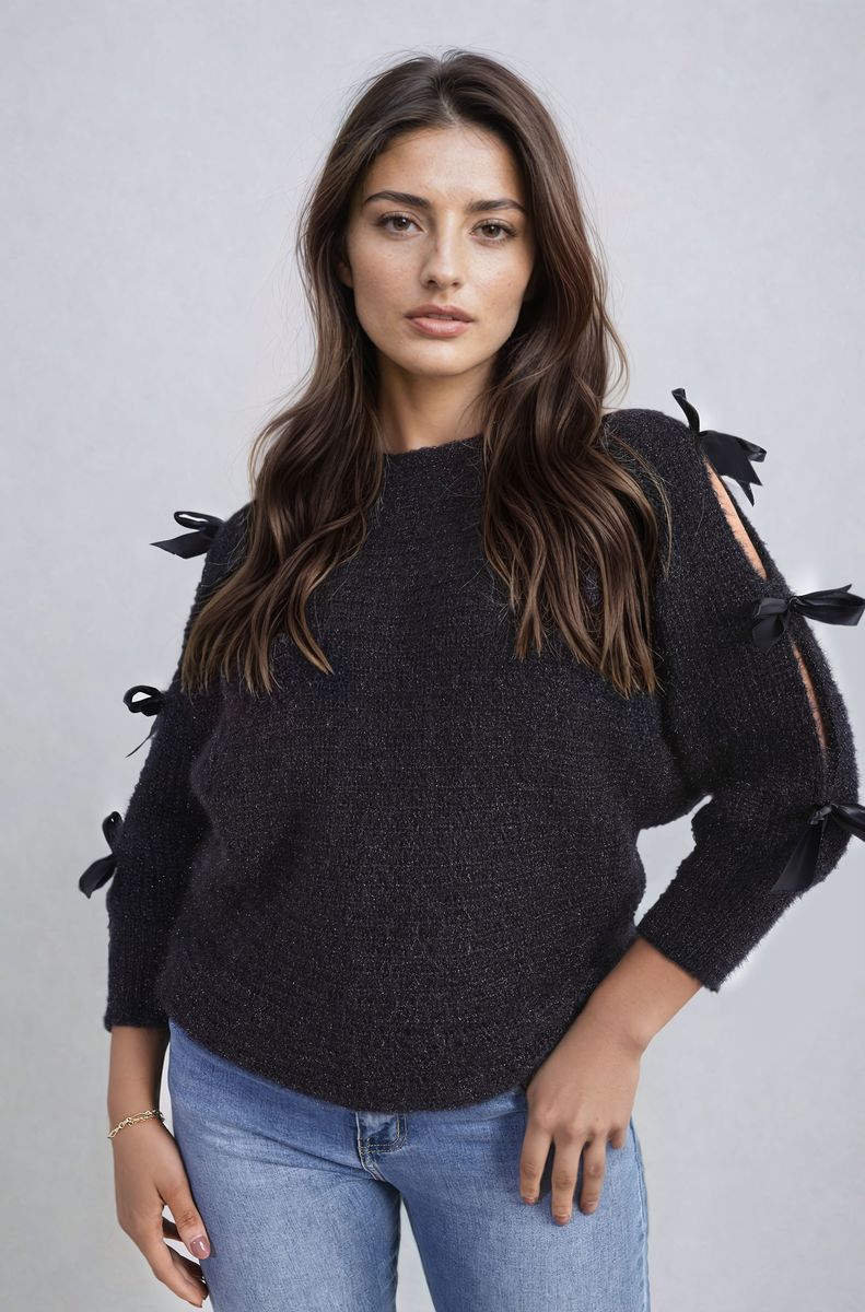 "Chunky knitted top with cut-out tie bow sleeve detail in beige, perfect for cozy winter wear."