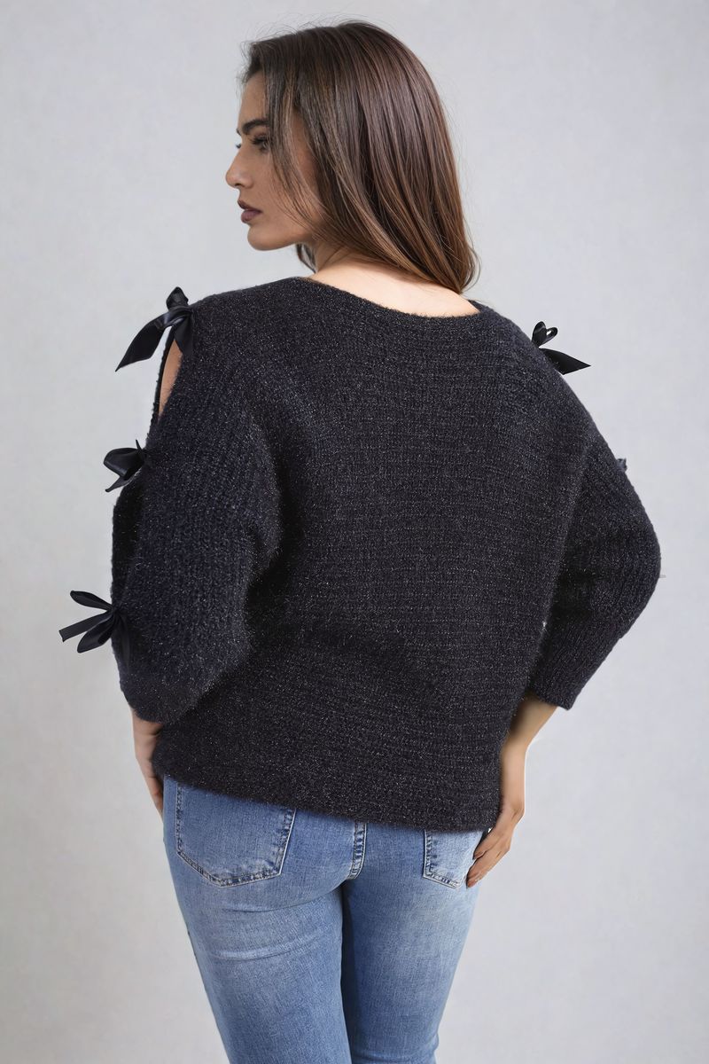 "Chunky knitted top with cut-out tie bow sleeve detail in beige, perfect for cozy winter wear."