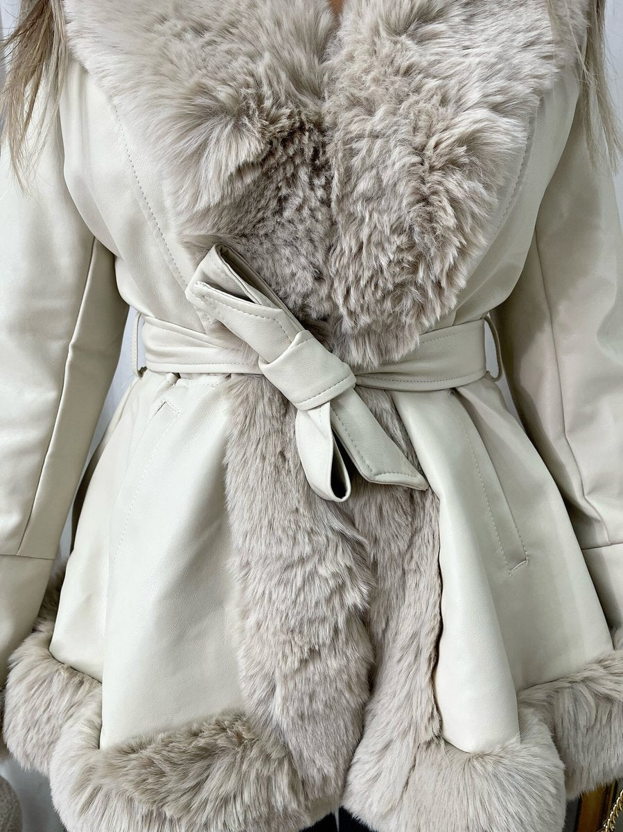 "Model wearing a faux fur trim winter jacket, ideal for cold weather fashion."