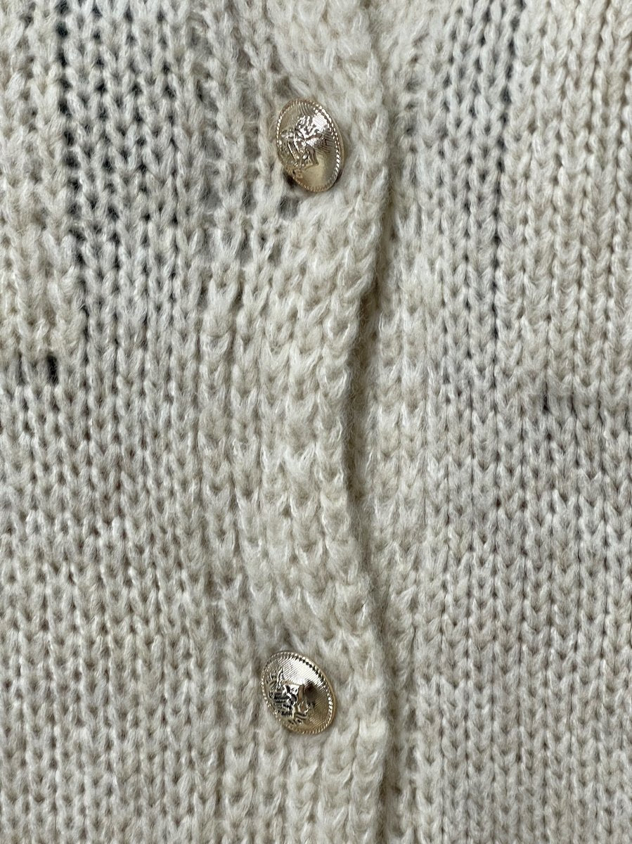 "Oversized beige button-down chunky knitted top with a relaxed fit, crafted from premium knit fabric for a cozy and stylish look."