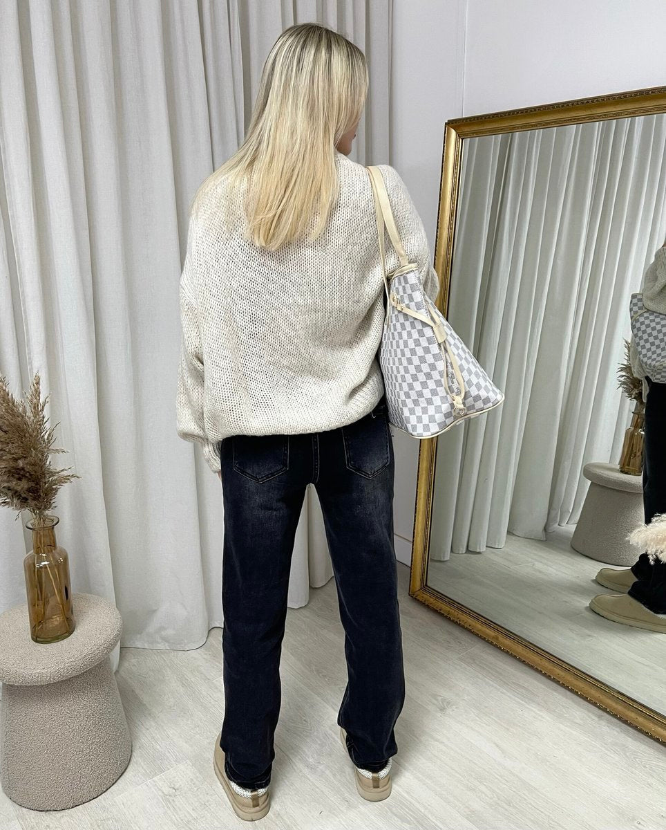 "Oversized beige button-down chunky knitted top with a relaxed fit, crafted from premium knit fabric for a cozy and stylish look."