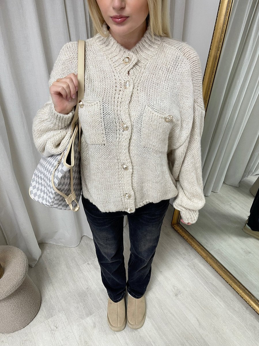 "Oversized beige button-down chunky knitted top with a relaxed fit, crafted from premium knit fabric for a cozy and stylish look."