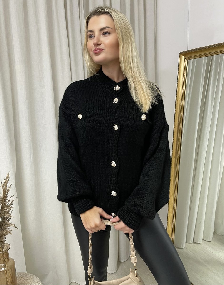 "Oversized black button-down chunky knitted top with a relaxed fit, crafted from premium knit fabric for a cozy and stylish look."
