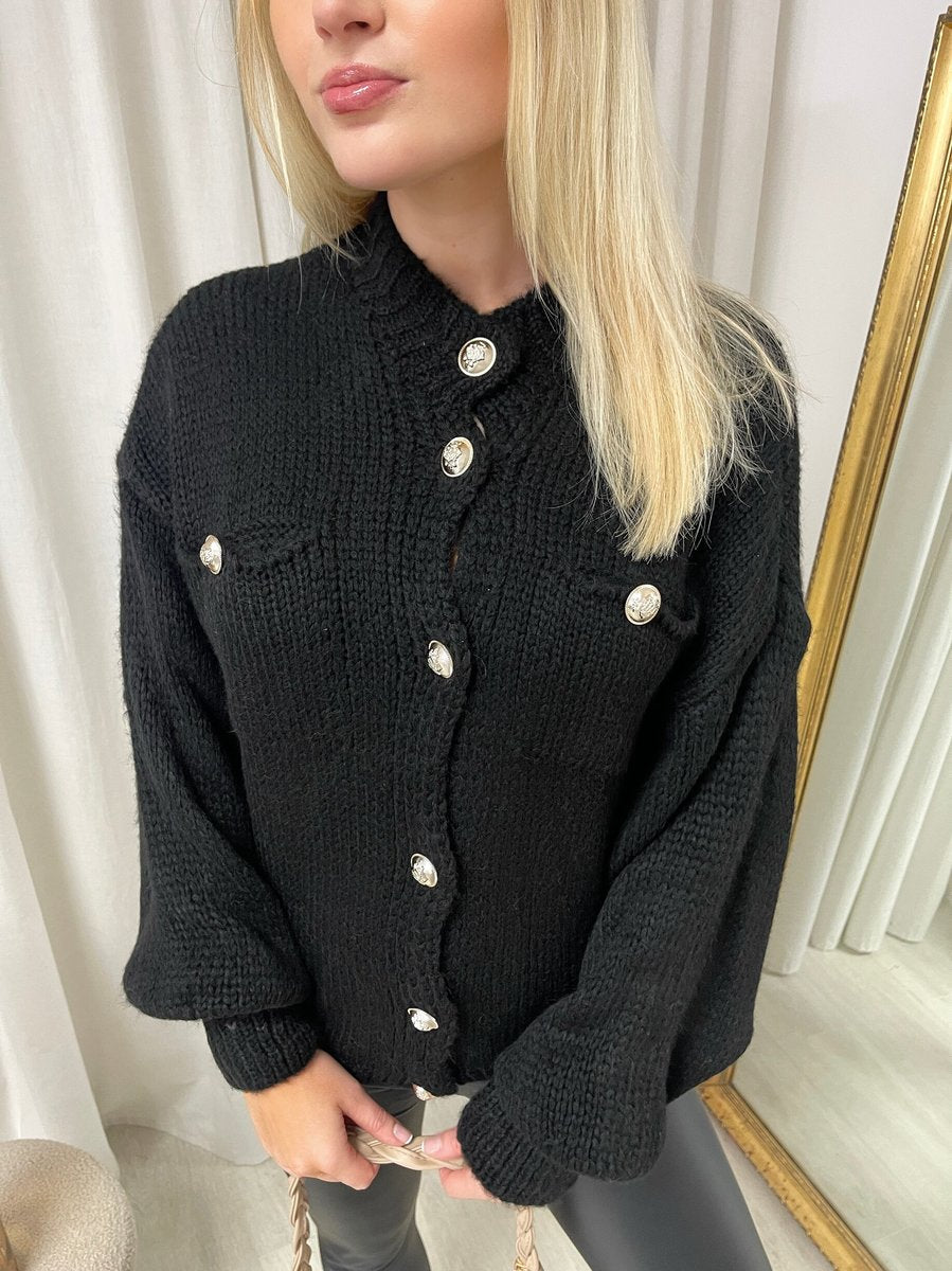 "Oversized black button-down chunky knitted top with a relaxed fit, crafted from premium knit fabric for a cozy and stylish look."