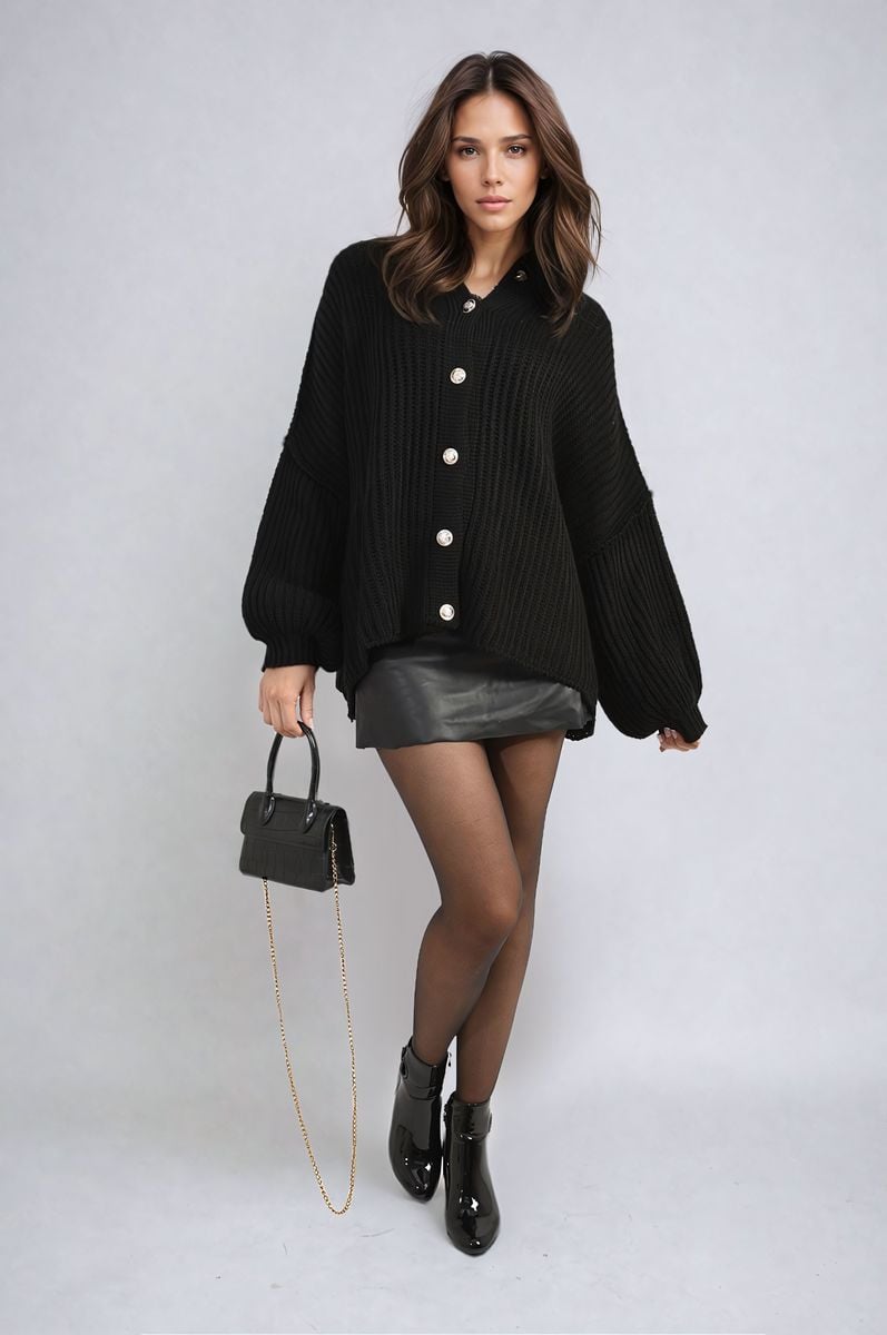 "Oversized black chunky knitted top with a relaxed fit, crafted from premium knit fabric for a cozy and stylish look."