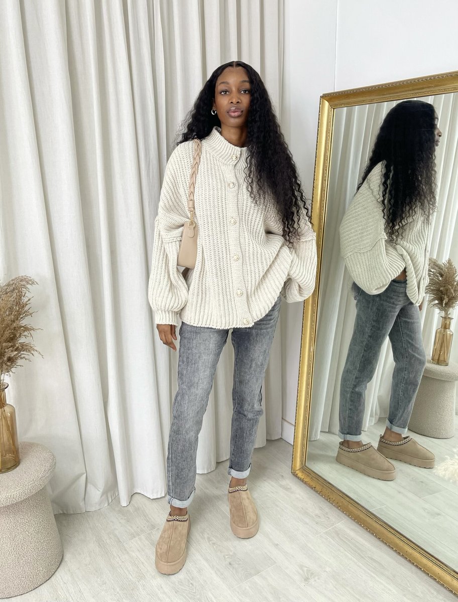 "Oversized white chunky knitted top with a relaxed fit, crafted from premium knit fabric for a cozy and stylish look."