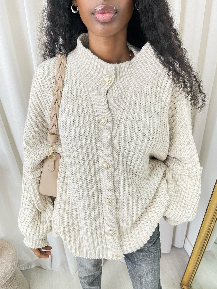 "Oversized white chunky knitted top with a relaxed fit, crafted from premium knit fabric for a cozy and stylish look."