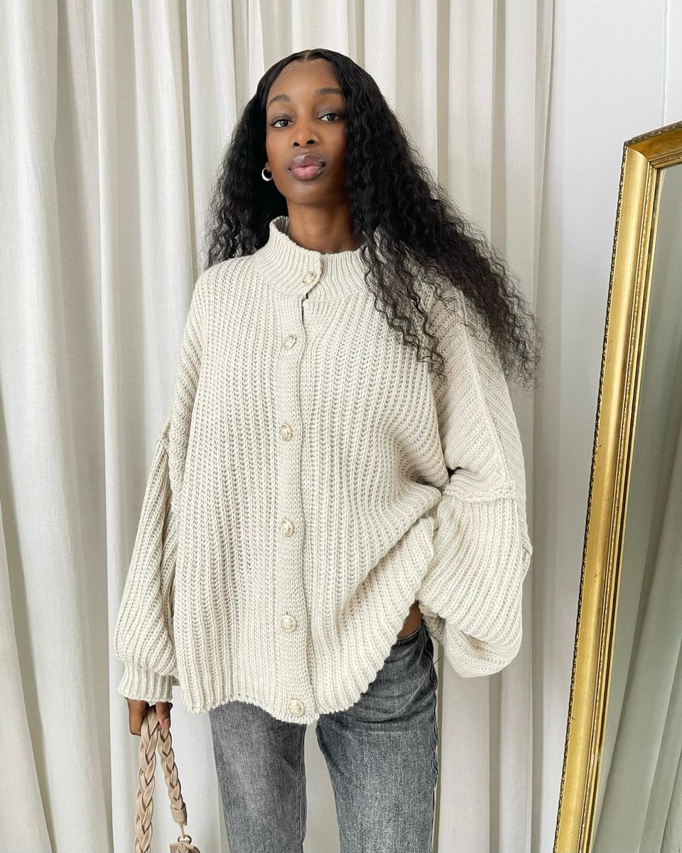 "Oversized cream chunky knitted top with a relaxed fit, crafted from premium knit fabric for a cozy and stylish look."