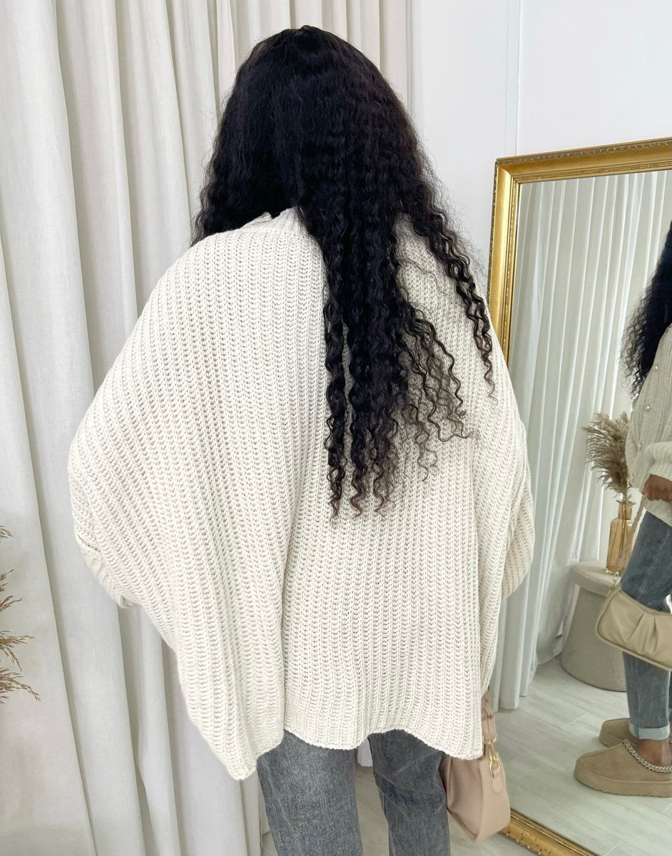 "Oversized white chunky knitted top with a relaxed fit, crafted from premium knit fabric for a cozy and stylish look."