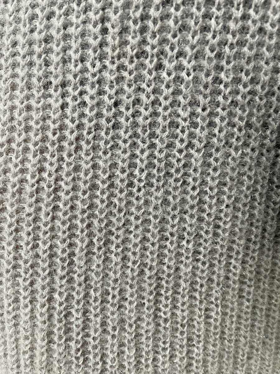 "Chunky roll neck knitted jumper in a cozy design, perfect for winter wear. Features a stylish roll neck and warm chunky texture."