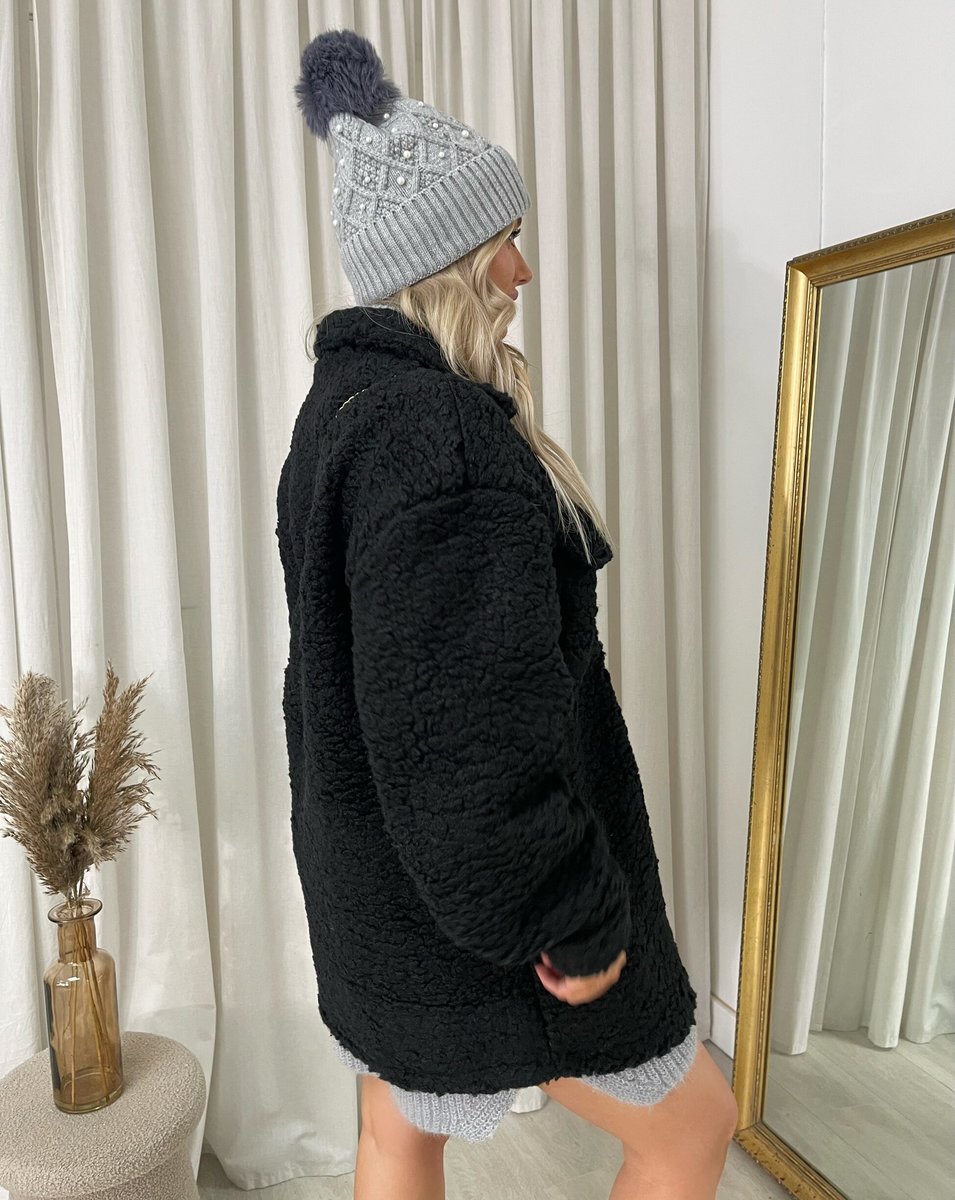 "Stylish button-down collared winter coat jacket for women in classic black, perfect for cold weather and formal occasions."