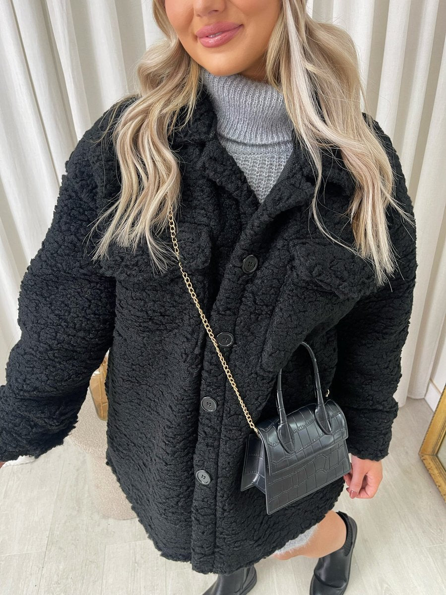 "Stylish button-down collared winter coat jacket for women in classic black, perfect for cold weather and formal occasions."