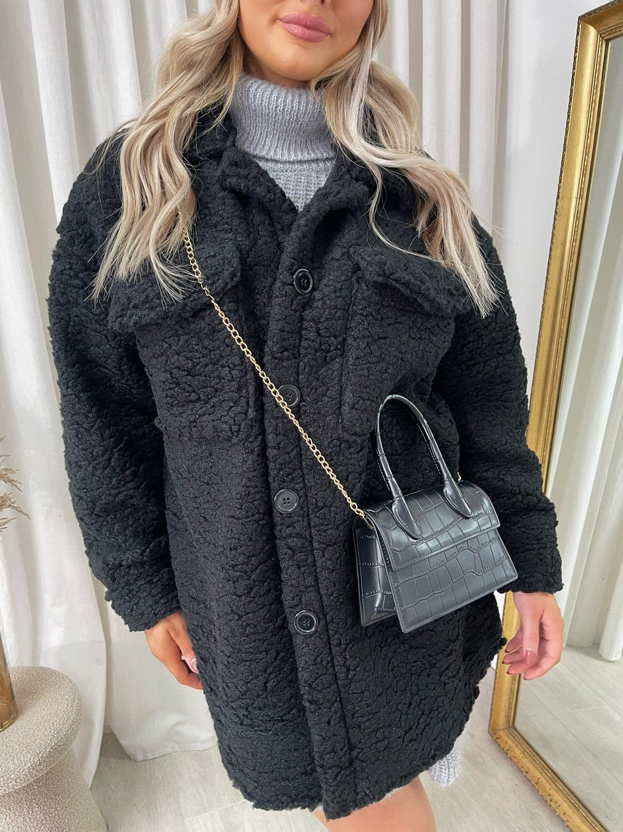 "Stylish button-down collared winter coat jacket for women in classic black, perfect for cold weather and formal occasions."