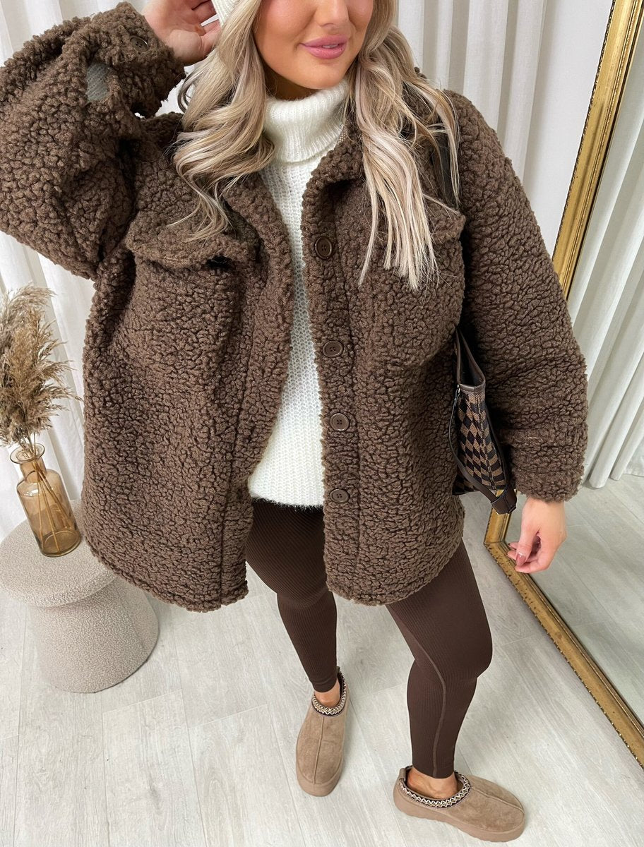 "Stylish button-down collared winter coat jacket for women in classic black, perfect for cold weather and formal occasions."