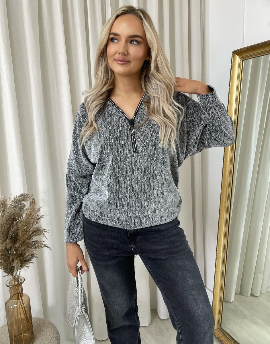 "Front Zip Detail Glitz Top with a shimmering finish, featuring a sleek zip design for a stylish and versatile look."