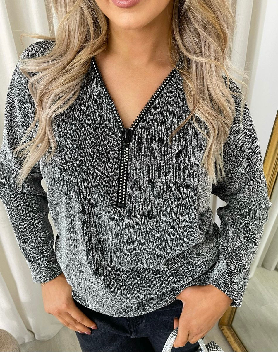 "Front Zip Detail Glitz Top with a shimmering finish, featuring a sleek zip design for a stylish and versatile look."