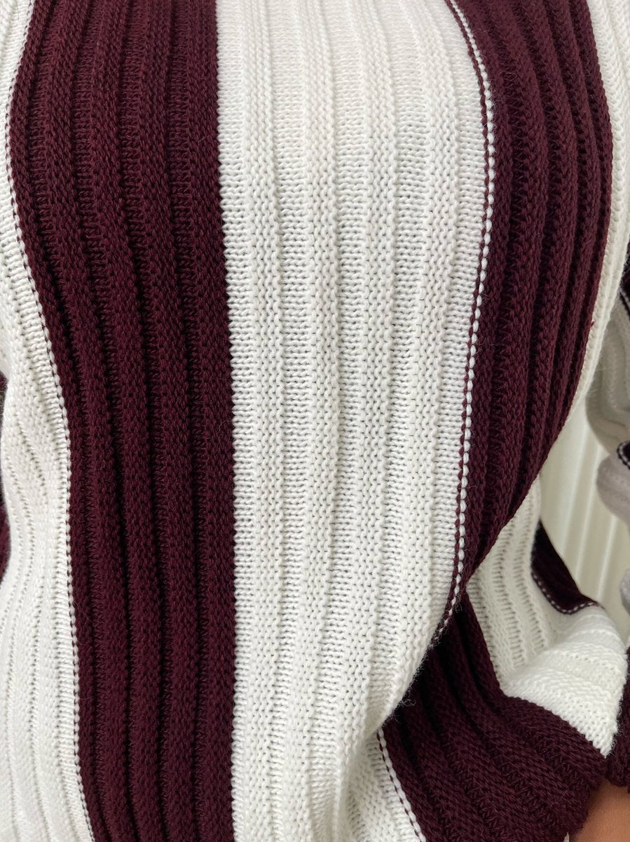 "A stylish roll neck stripe knitted jumper in soft, warm fabric, ideal for layering during chilly days."