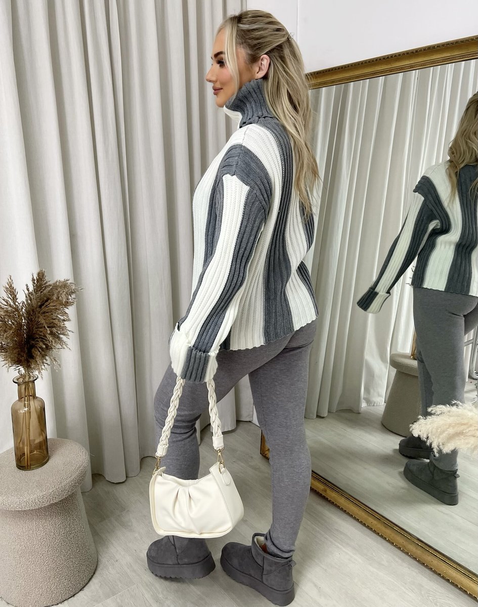 "A stylish roll neck stripe knitted jumper in soft, warm fabric, ideal for layering during chilly days."
