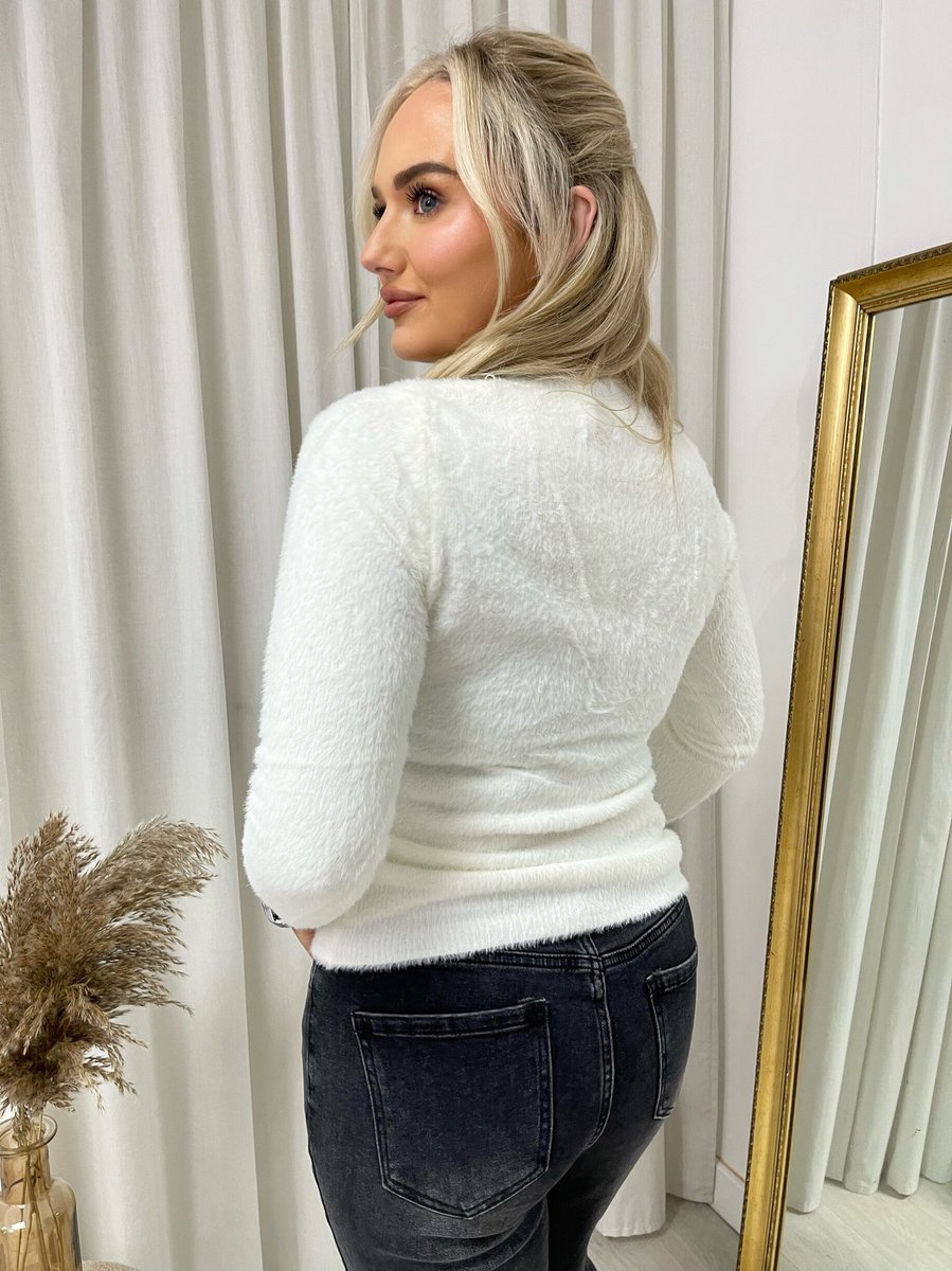 "Fitted long sleeve fluffy knitted top in beige, perfect for winter layering and cozy wear."