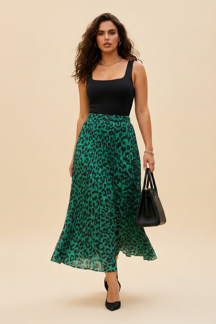 Tall mixed-race model wearing an emerald and black pleated midi skirt in a studio