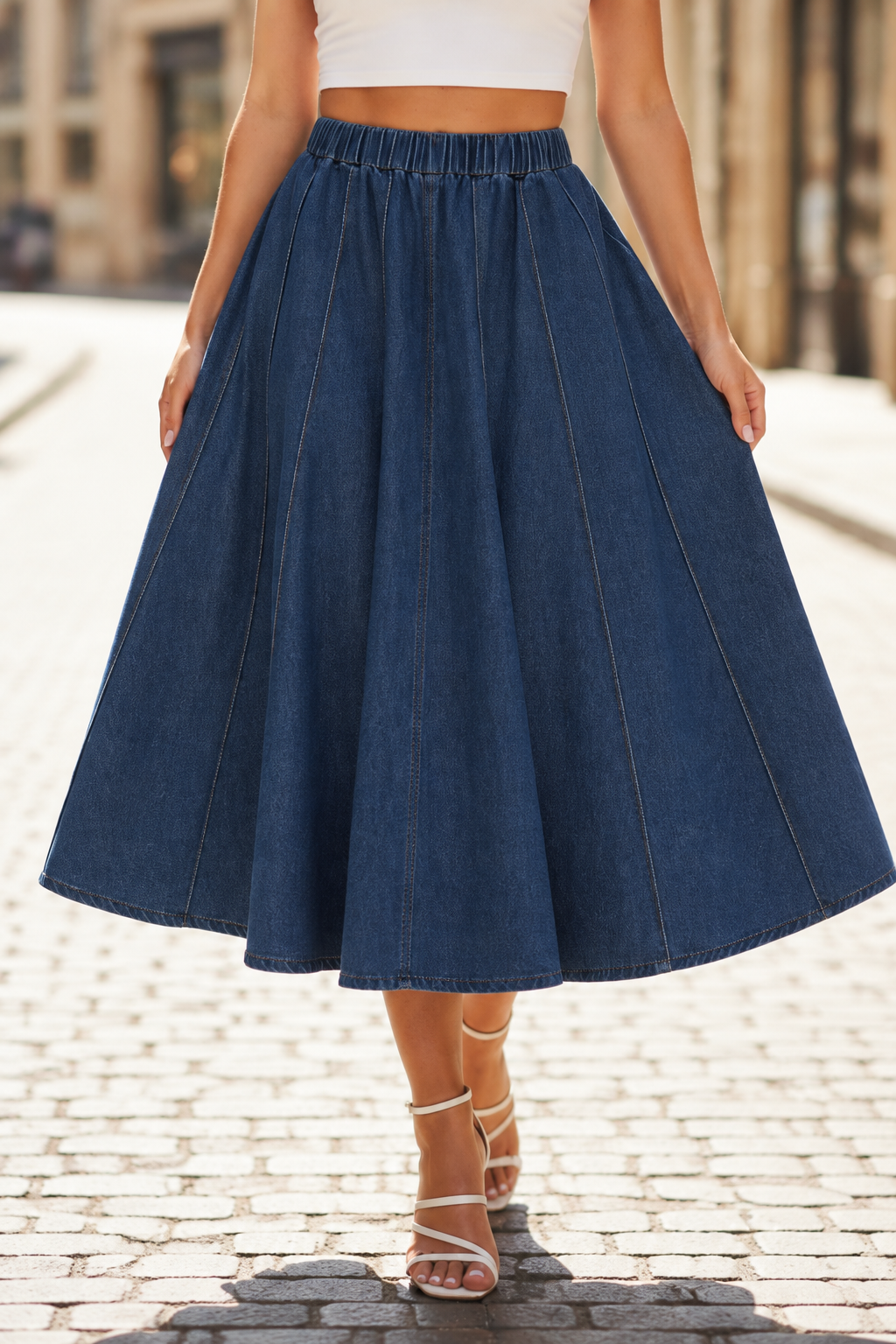 Dark blue denim circle-panel midi skirt with elastic waistband and flared pleated panels