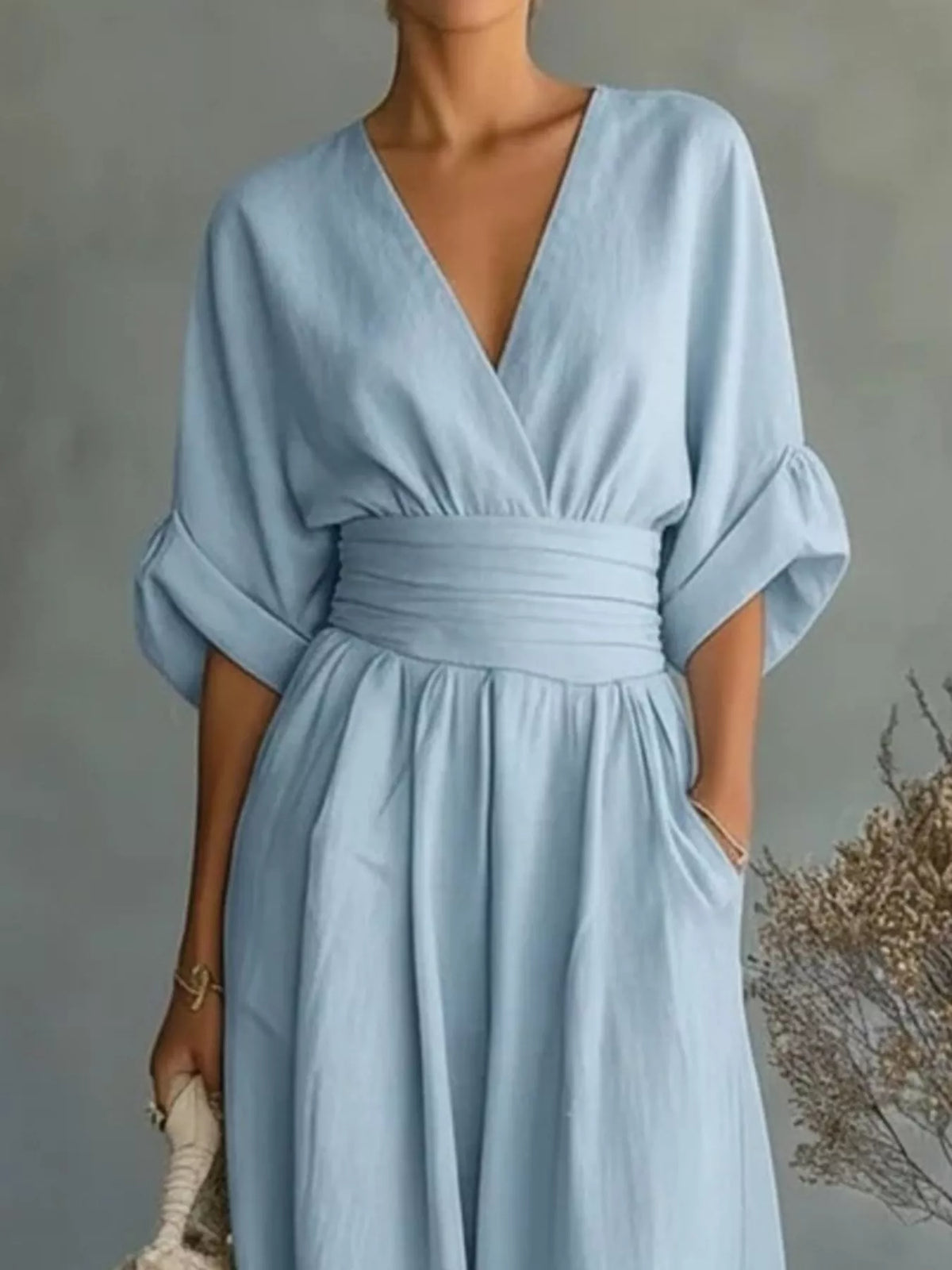 Light blue plus size jumpsuit with V-neck, gathered elastic waist, wide-leg fit