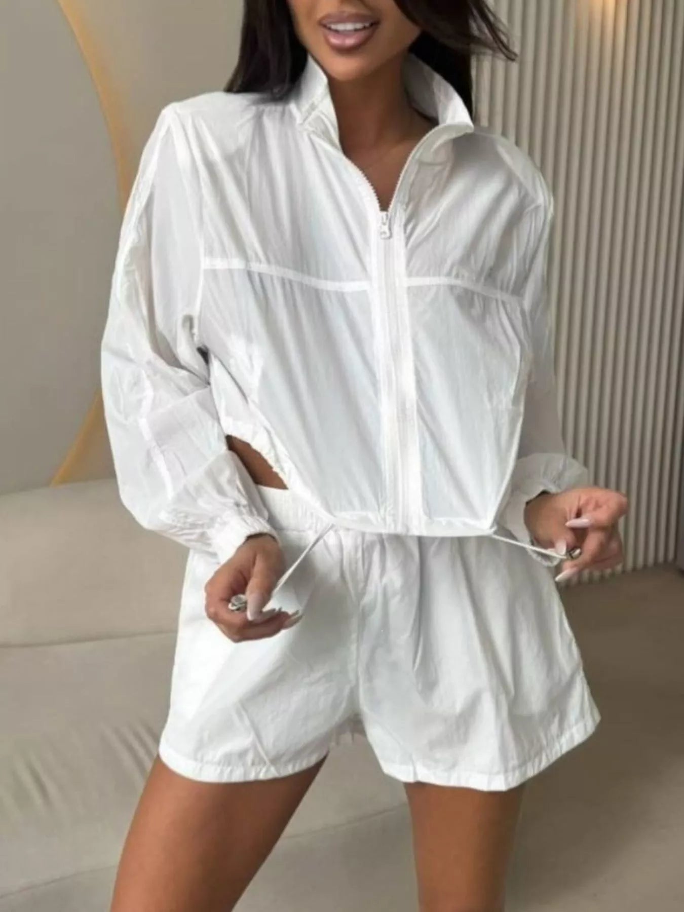 White zip-front long sleeve outerwear set with drawstring elastic-waist shorts
