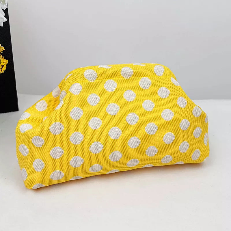 Yellow knit polka-dot clutch with rounded top