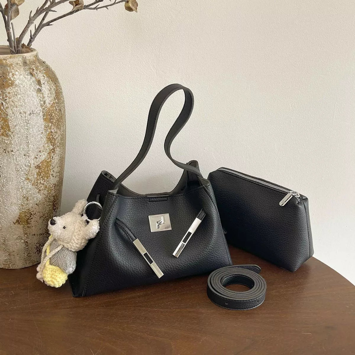 Black crossbody bag set with silver lock detail: zip tote, small zip bag, and strap