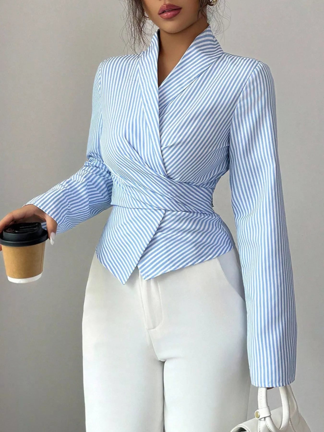 Blue striped long sleeve wrap blouse with long sleeves and tied waist peplum