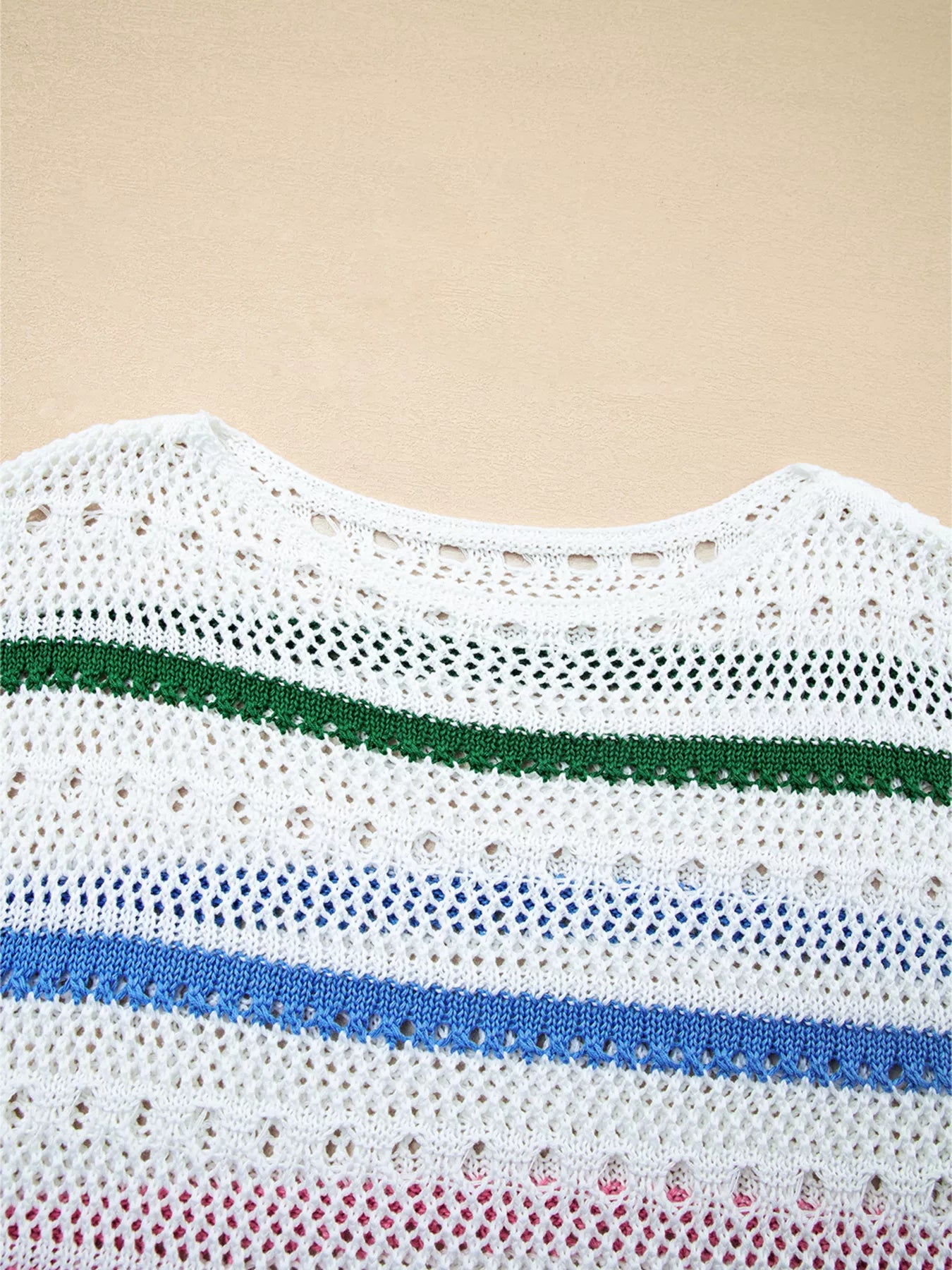 White pointelle knit sweater neckline and striped band detail in green and blue