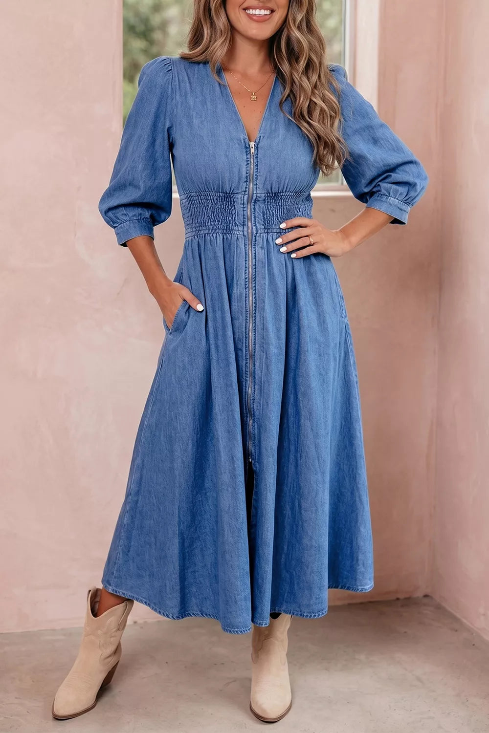 Blue denim V-neck midi dress with shirred waist and metal zipper, 3/4 sleeves