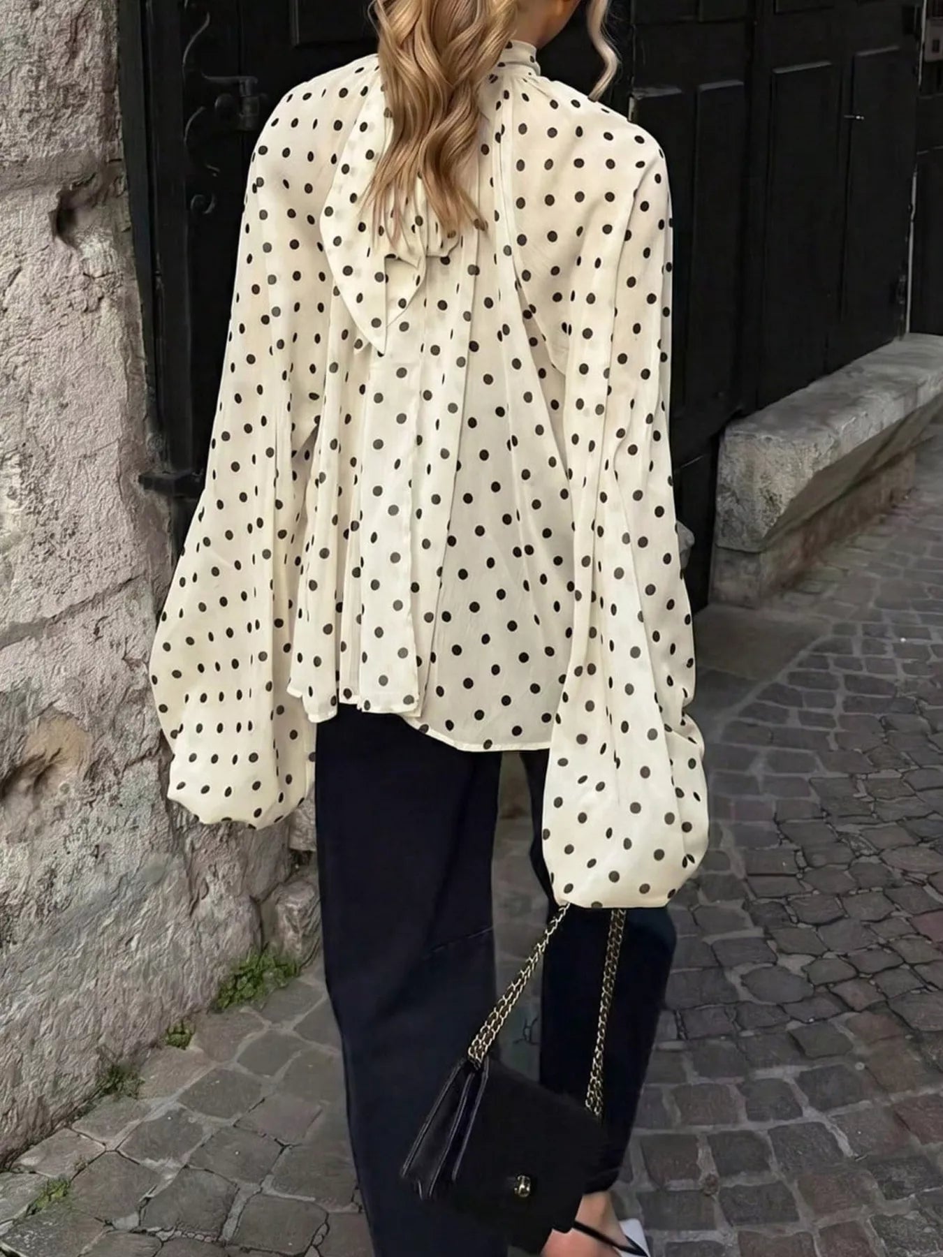 Ivory polka-dot blouse with standing high neck and billowy balloon sleeves