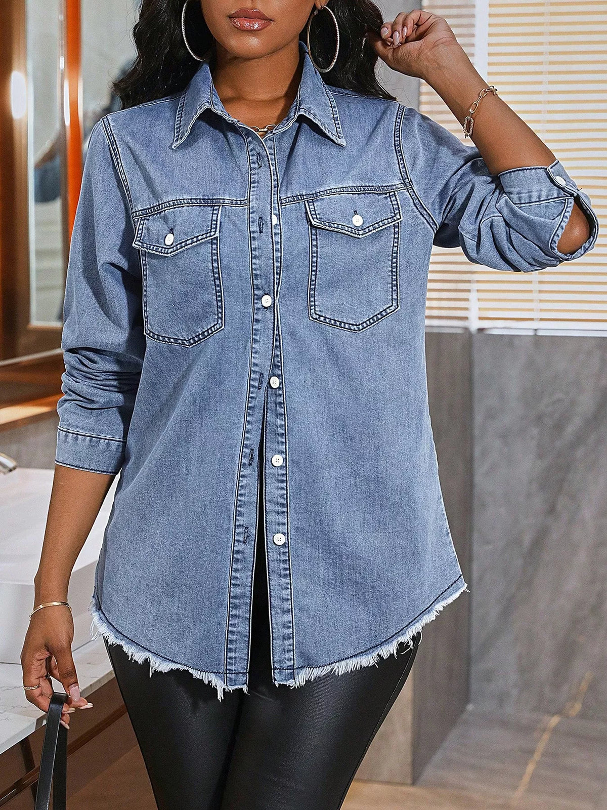 Light-wash button-up denim shirt, flap chest pockets, raw hem, long sleeves