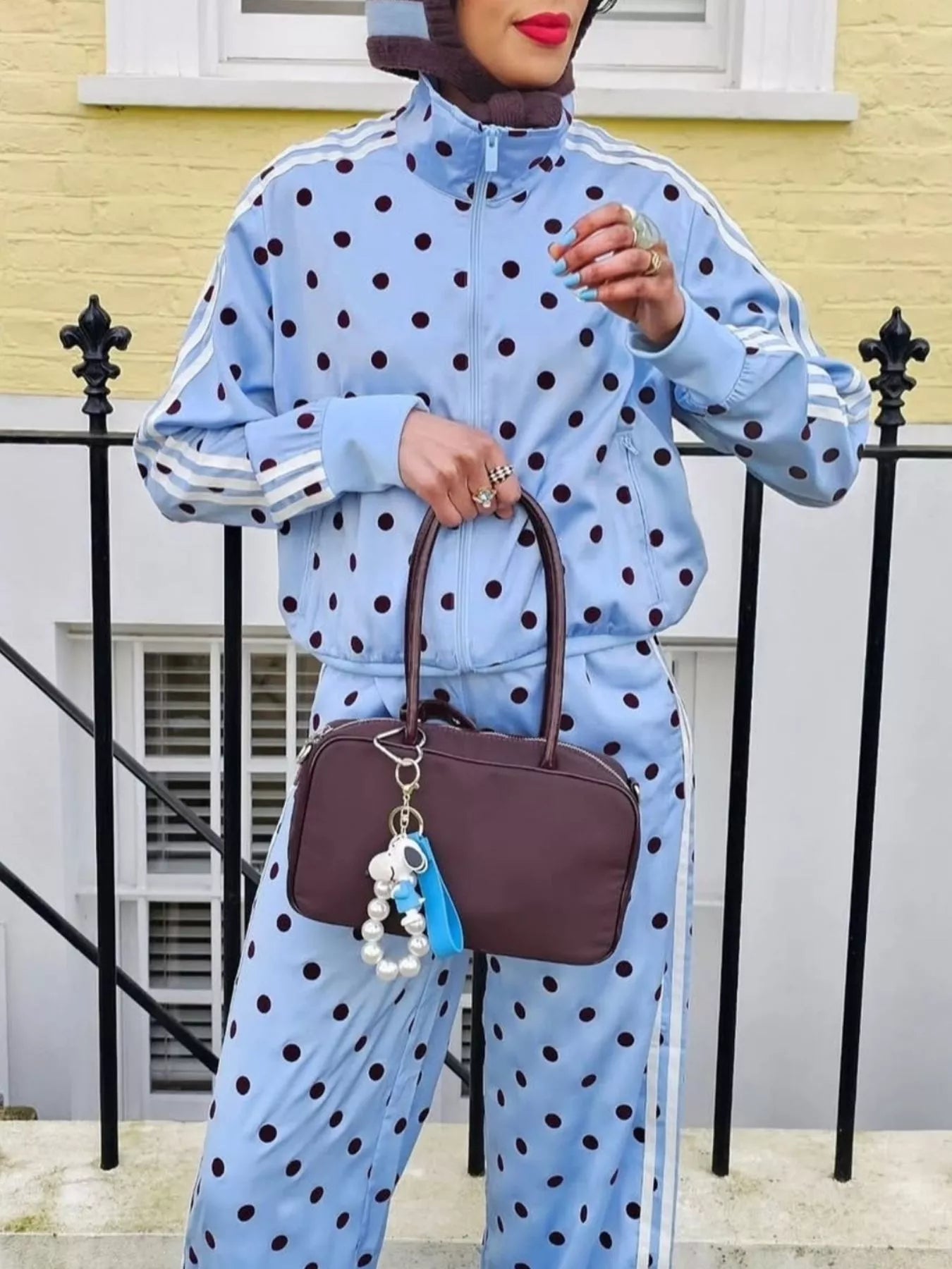 Sky blue polka-dot zip-up jacket and matching pants set with striped sleeve details