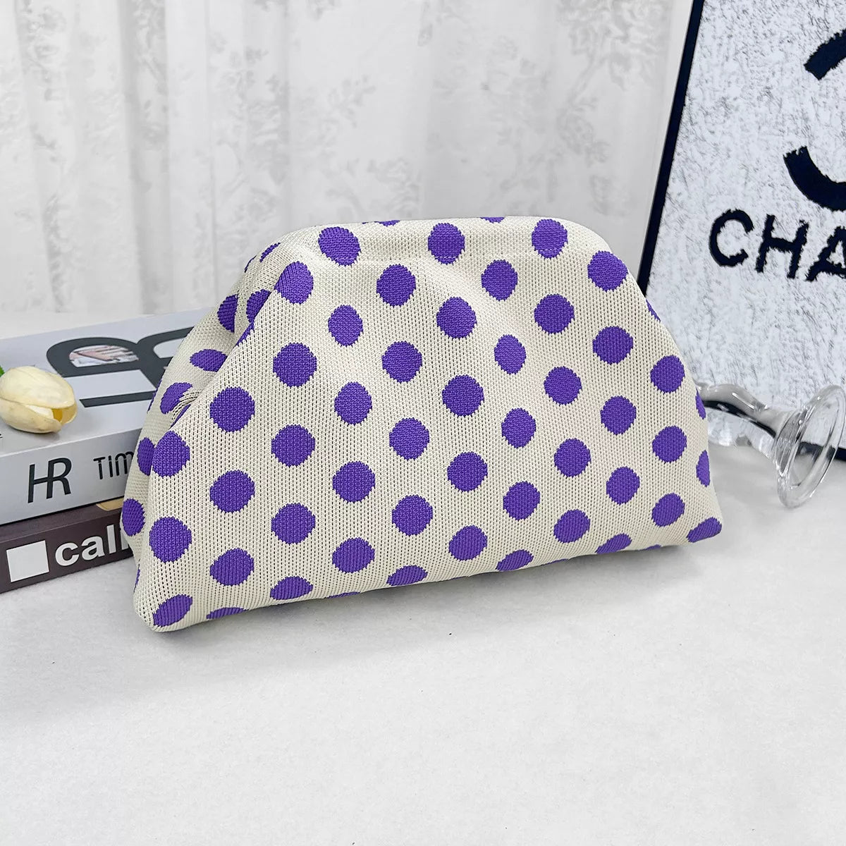 Purple knit polka-dot clutch with white dots