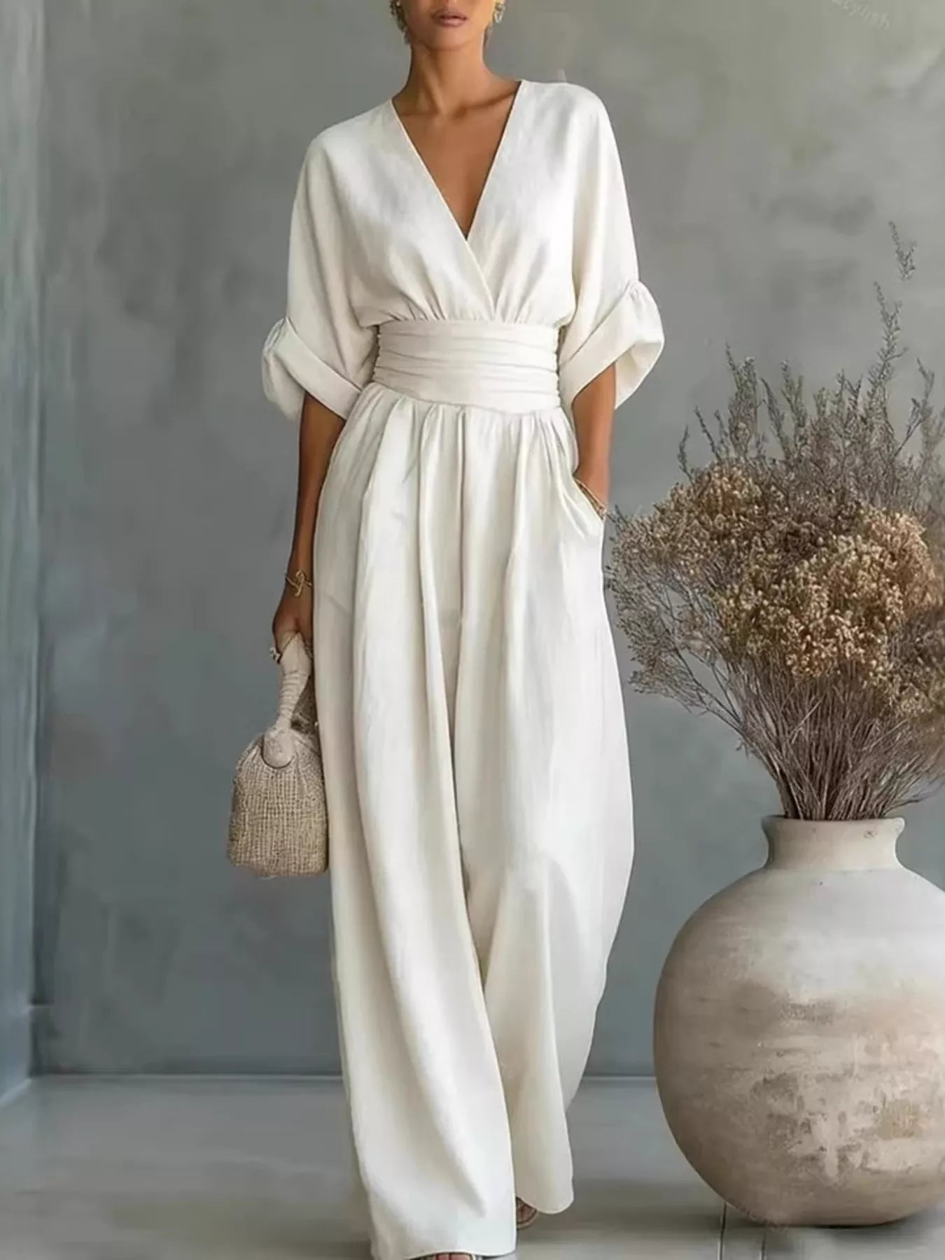 White plus size jumpsuit with V-neck, half sleeves, elastic waist, wide-leg trousers