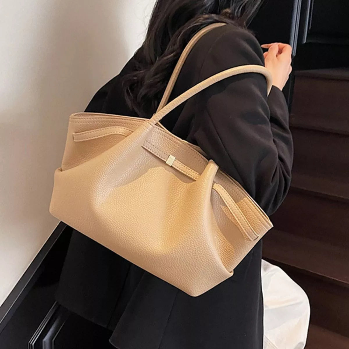Beige khaki PU leather shoulder bag held by handles with front flap detail