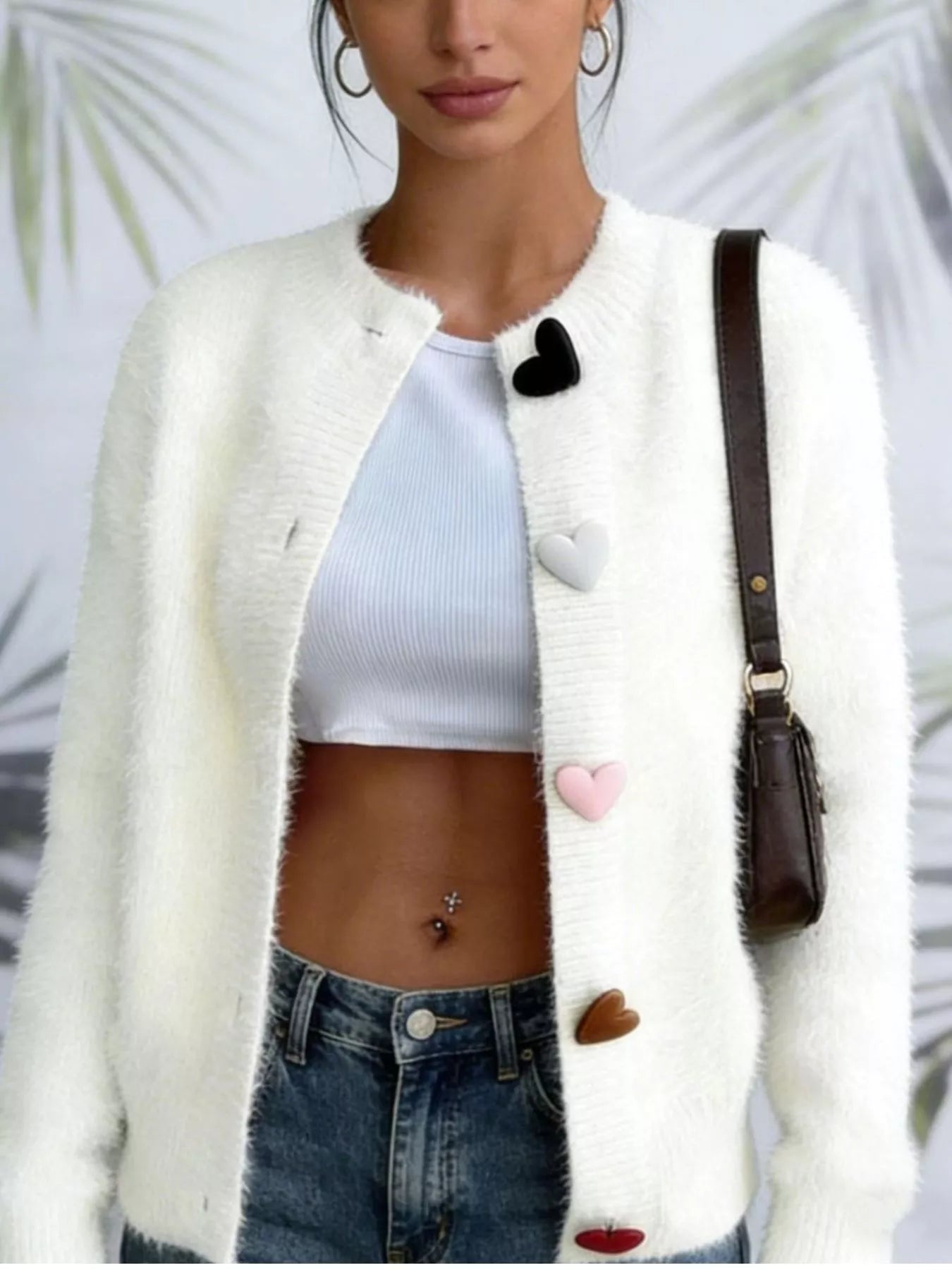 White fuzzy long-sleeve cardigan with heart-button front and heart accents