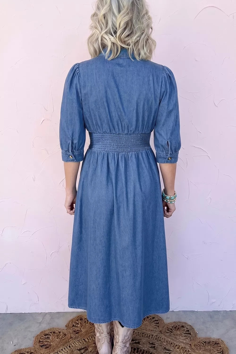 Blue denim midi dress with shirred waist, back view, 3/4 sleeves