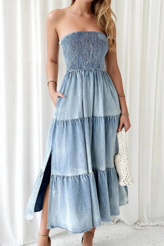Light blue smocked tube denim dress with tiered ruffles and side slit