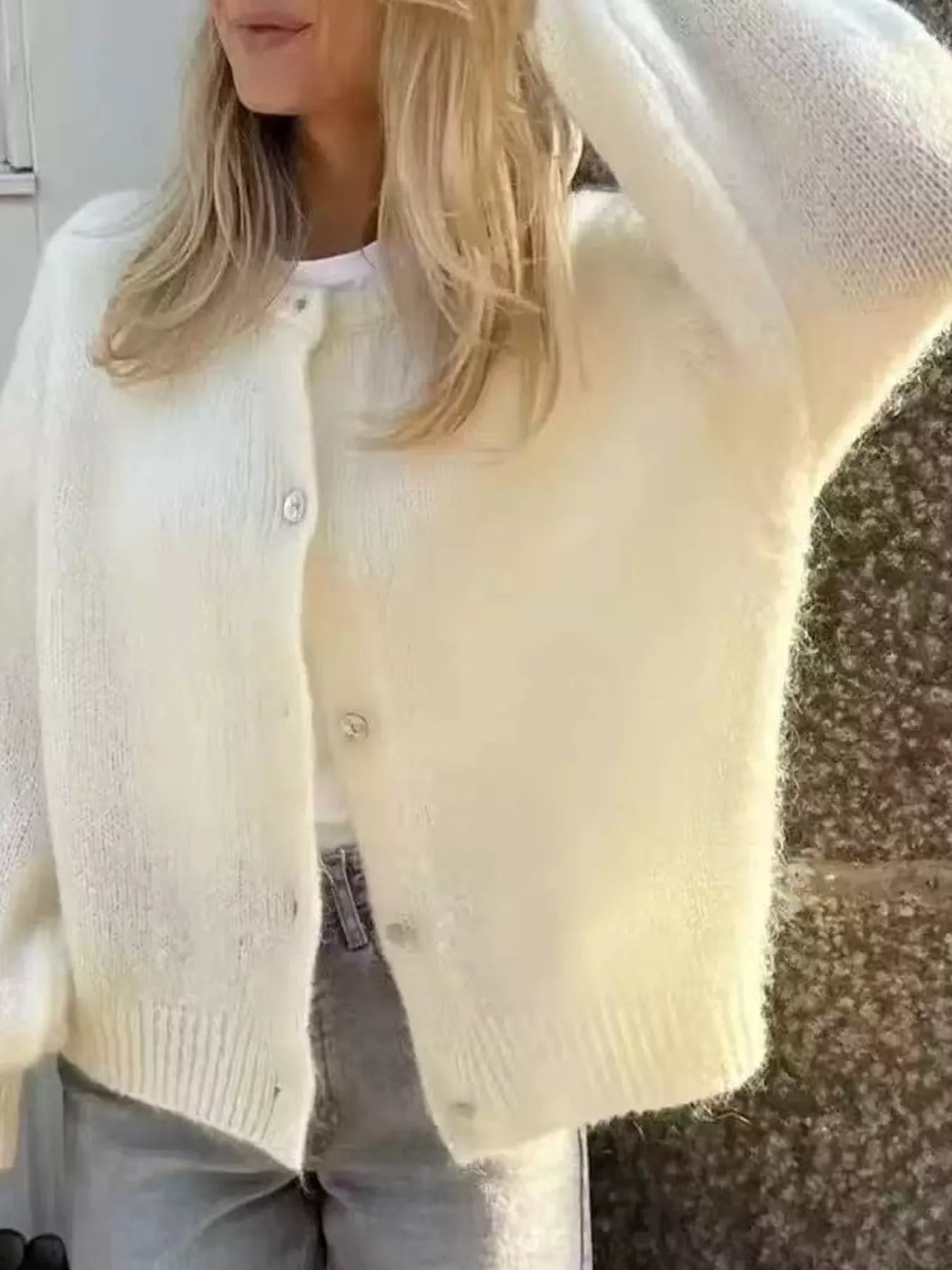 Off-white button-up long sleeve cardigan with front buttons and ribbed knit cuffs