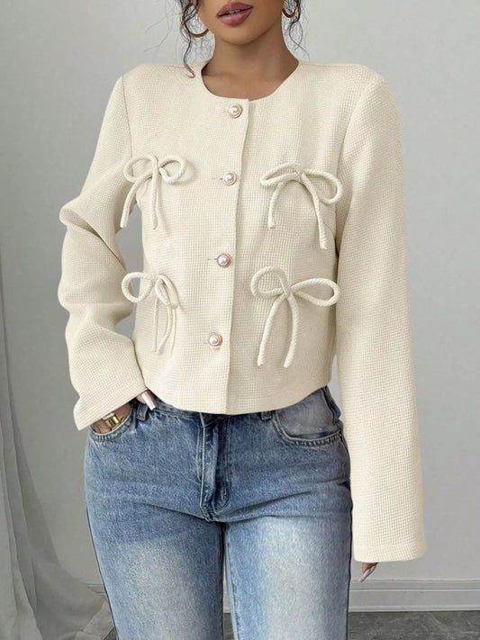 Cream cropped outerwear jacket with bow ties and gold-tone buttons