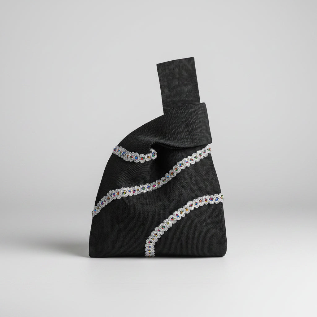Knot wrist bag in black with white and light blue beaded stripe detail