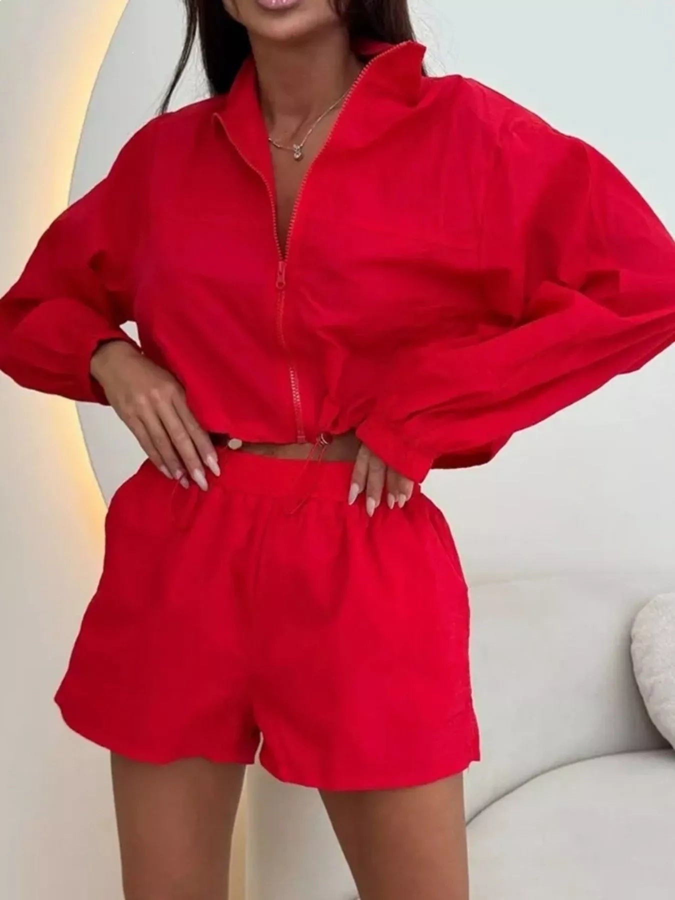 Red zip-up long-sleeve jacket and matching shorts set, front view, elastic waist