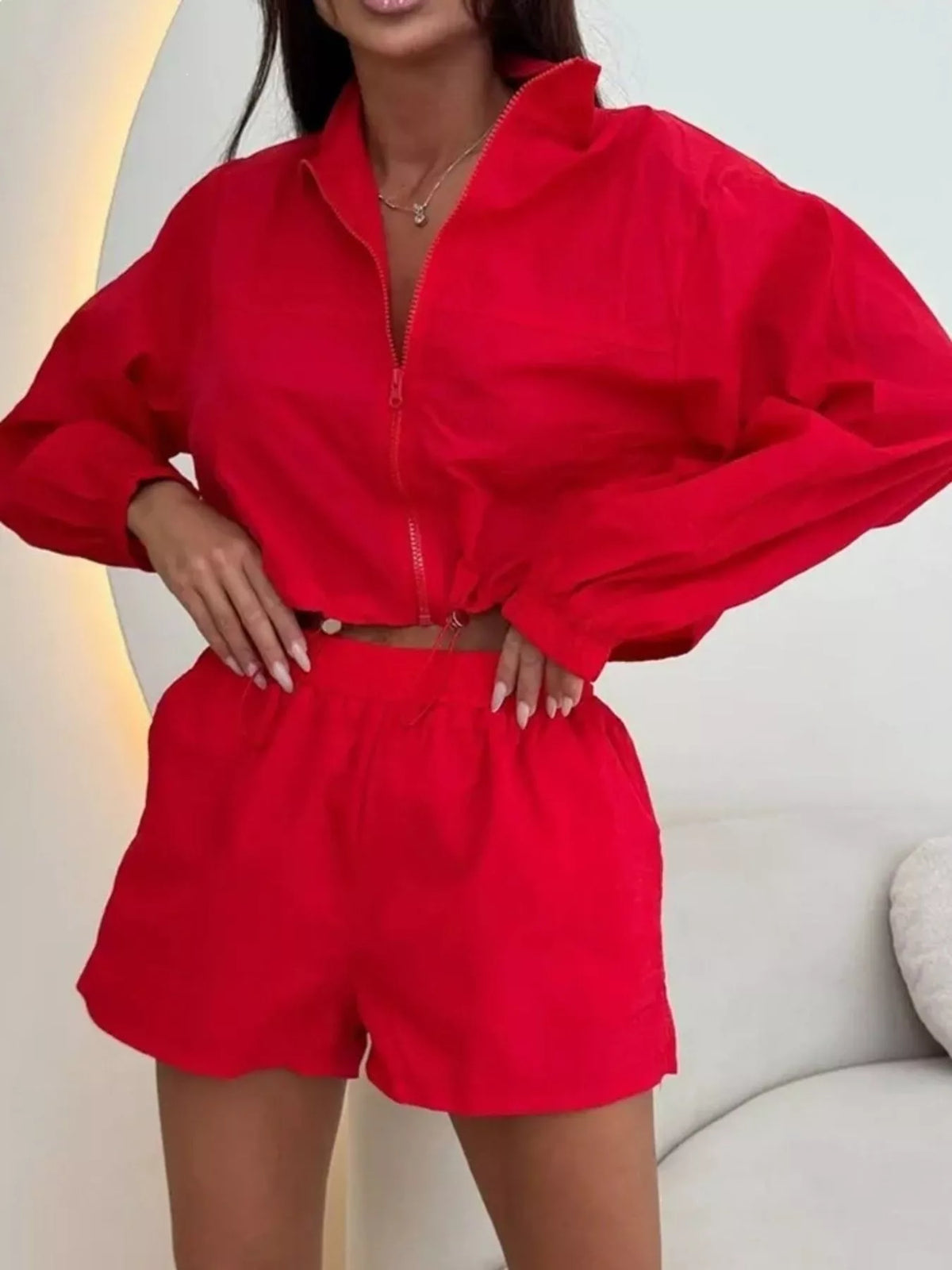 Red zip-up long-sleeve jacket and matching shorts set, front view, elastic waist
