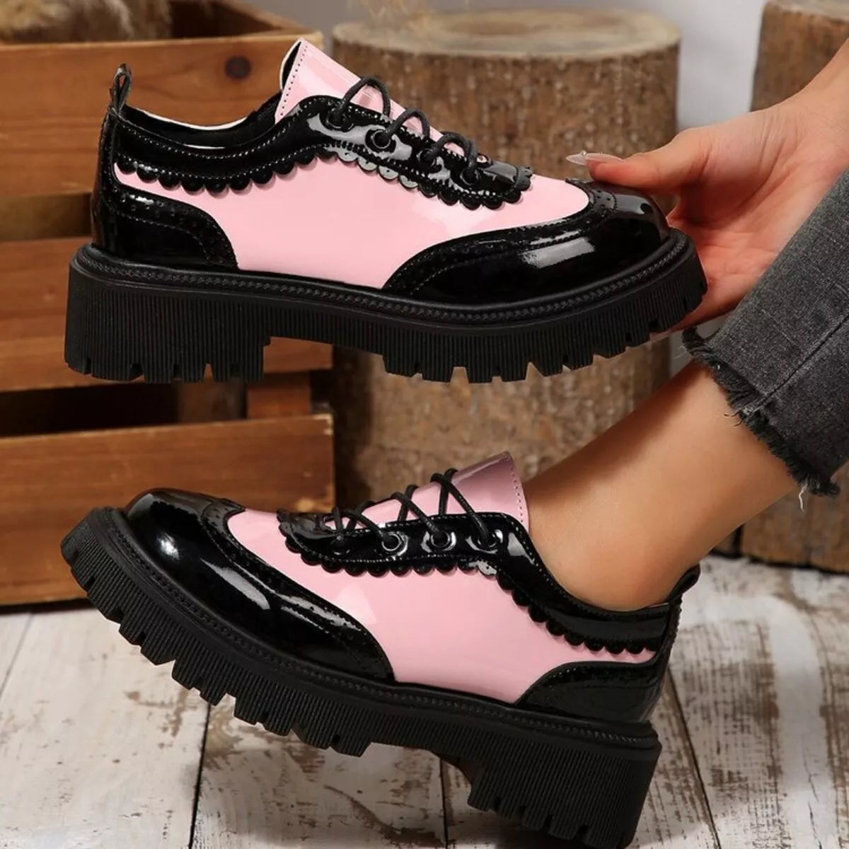 Pink panel platform loafers with black glossy toe, lace-up front, thick tread sole